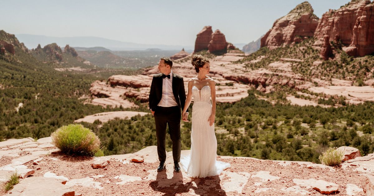 A bride and groom pose at their wedding in Sedona, Arizona.