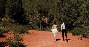 A bride and groom pose at their wedding in Sedona, Arizona.