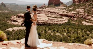 A bride and groom pose at their wedding in Sedona, Arizona.