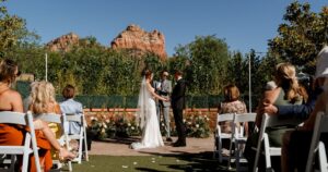 A bride and groom pose at their Sedona wedding at Amara Resort.