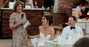 A bride and groom pose at their Sedona wedding reception at Amara Resort.