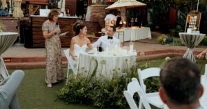 A bride and groom pose at their Sedona wedding reception at Amara Resort.