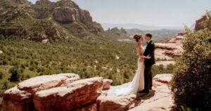 A bride and groom pose at their wedding in Sedona, Arizona.