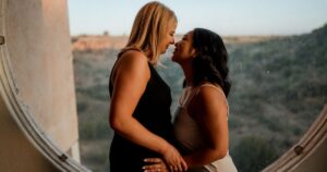 A couple poses indoors at Arcosanti, one of the 5 best summer engagement session locations in Arizona