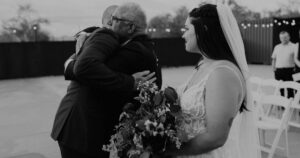 A bride, her father, and groom pose at a Tucson wedding at Wildhorse ranch.