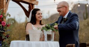 A bride and groom pose at their Tucson wedding at Wildhorse ranch.