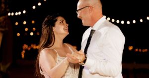 A bride and groom dance at their wedding reception at Wildhorse ranch.