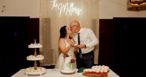 A bride and groom kiss at their wedding reception at Wildhorse ranch.