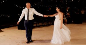 A bride and groom dance at their wedding reception at Wildhorse ranch.