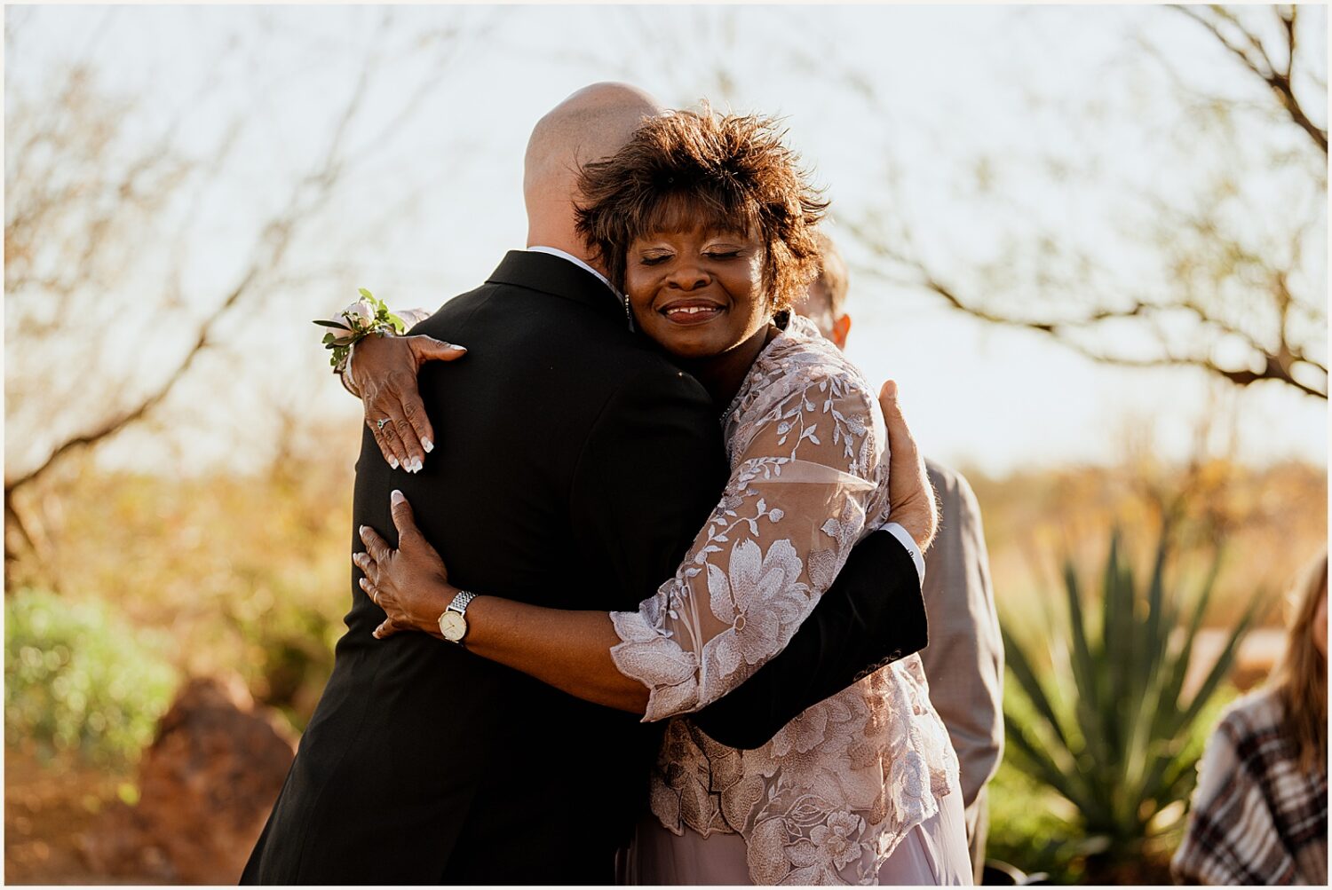 A groom hugs his mother-in-law.