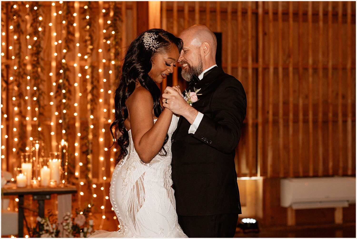 A bride and groom do a choreographed first dance.