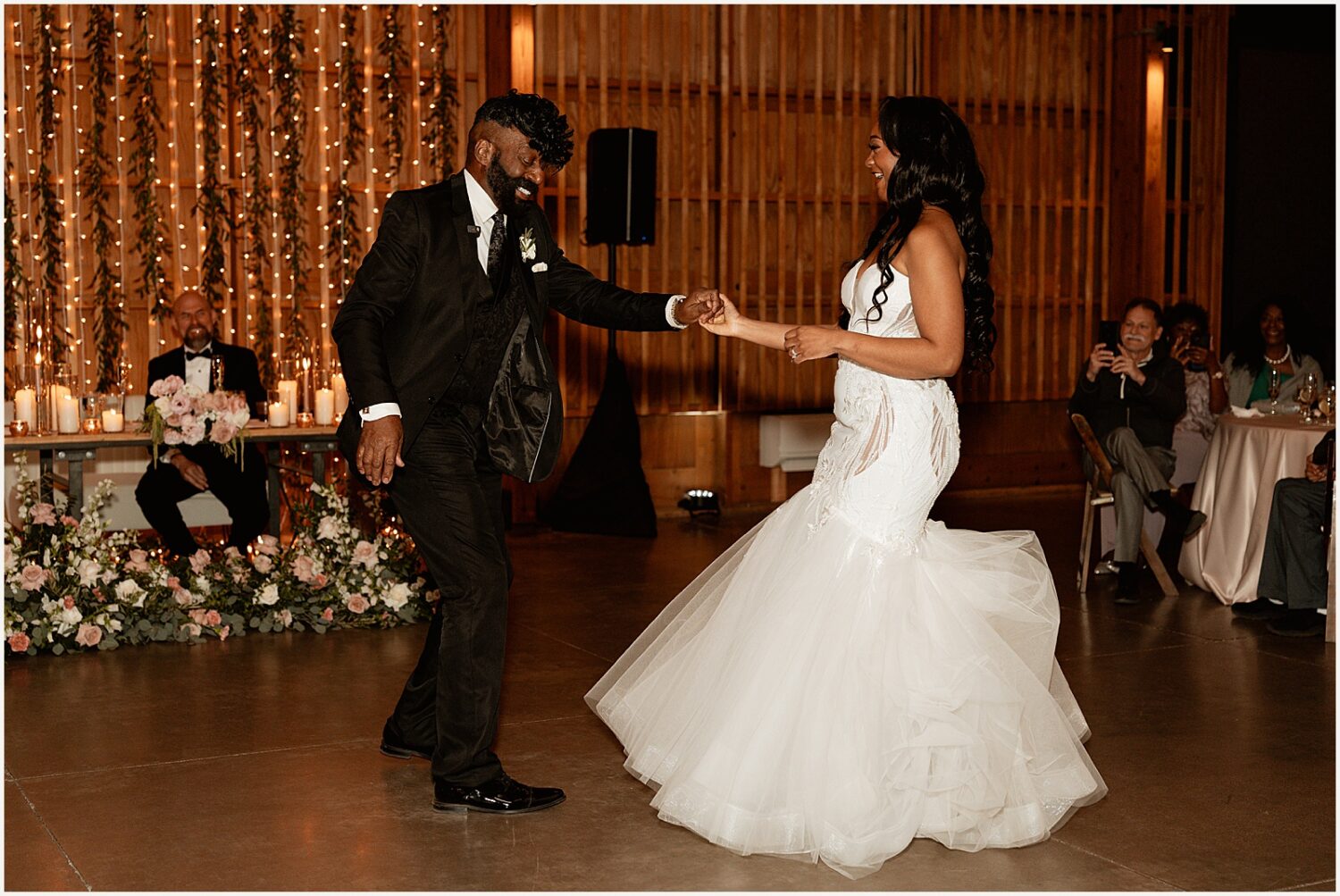 A bride dances with her father.
