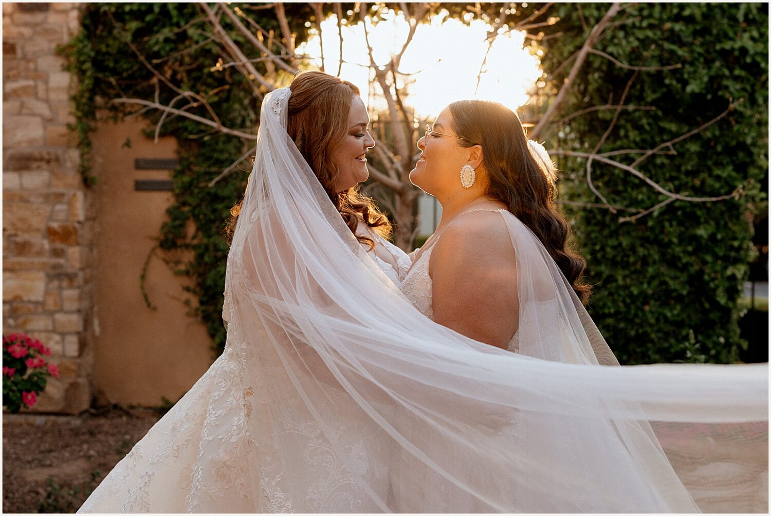 Two brides pose for golden hour photos at their Arizona wedding.