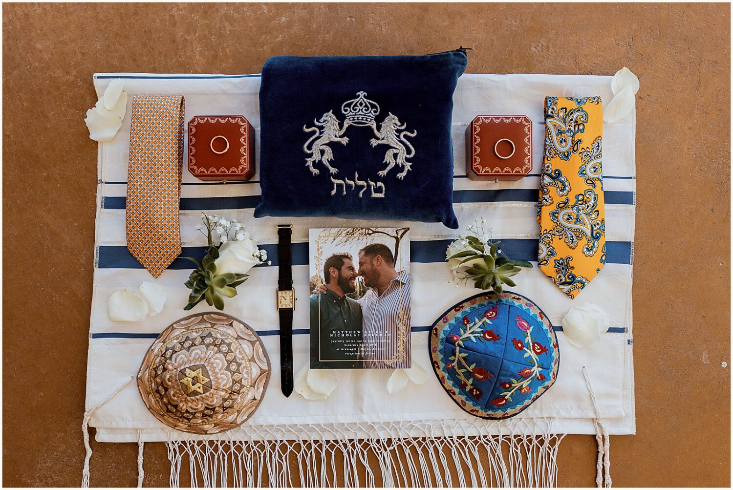 Items for a Jewish wedding lay on a Tallis at an Arizona wedding venue.