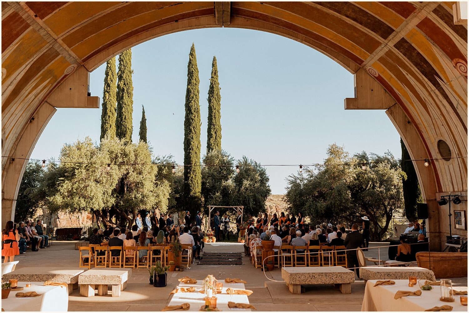 Wedding guests sit for a ceremony at Arcosanti Arizona.