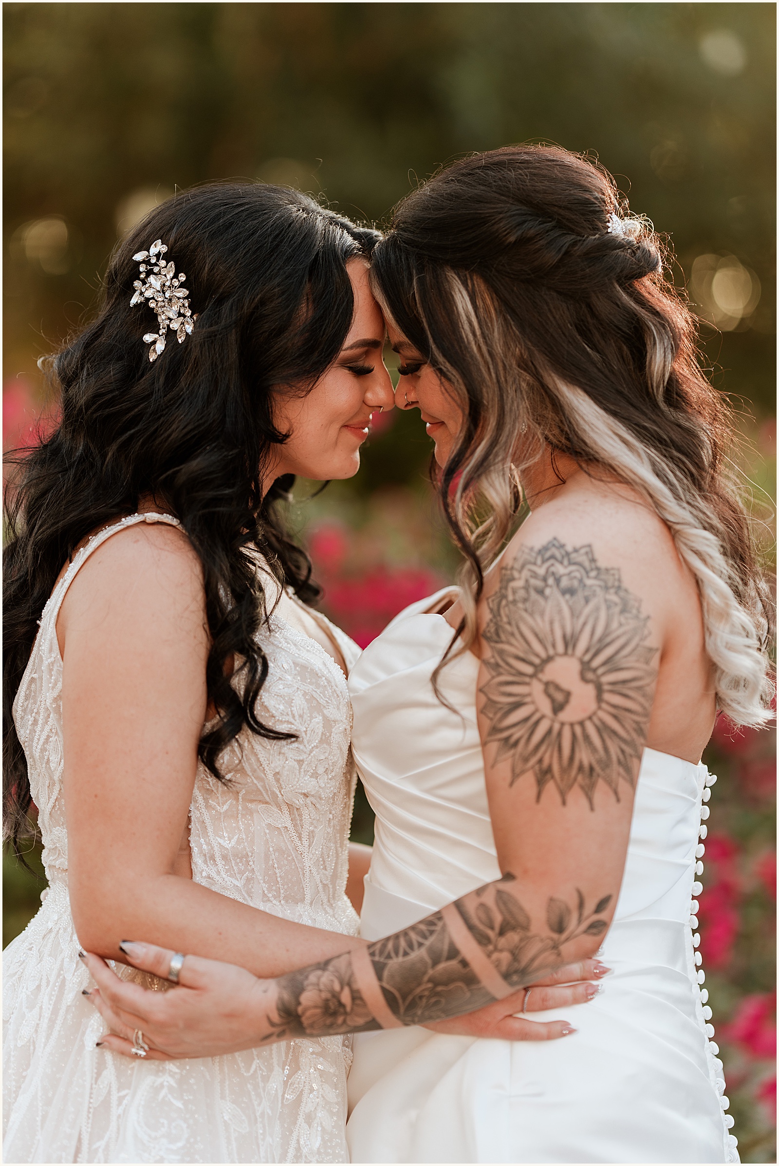 Two brides embrace at a Superstition manor wedding.
