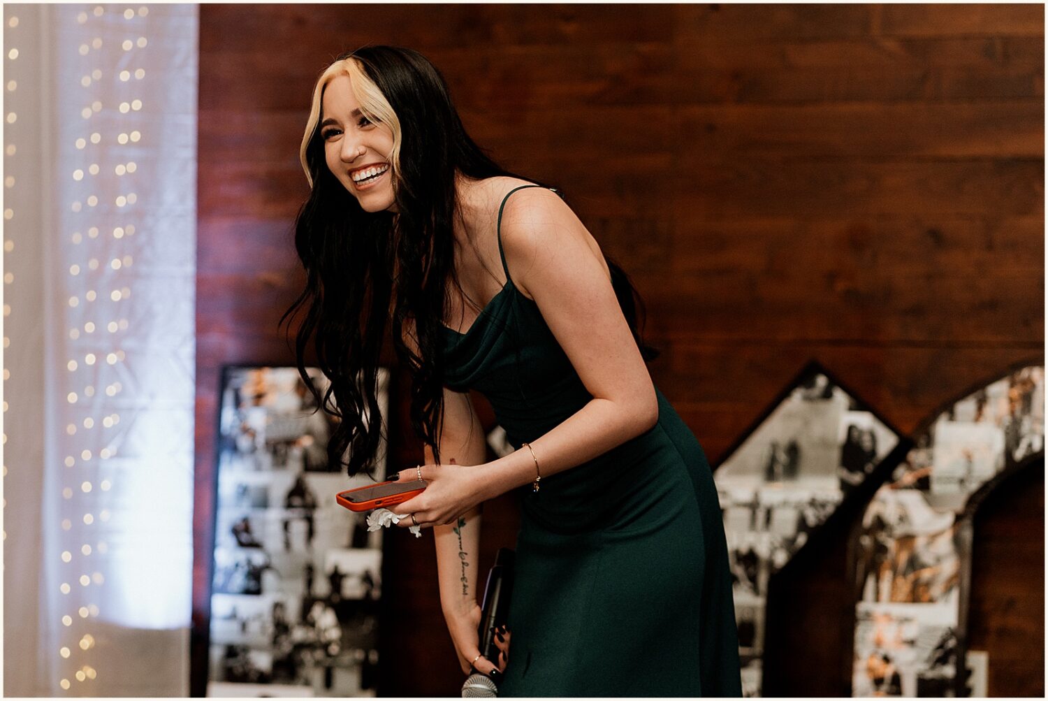A bridesmaid laughs during a toast.