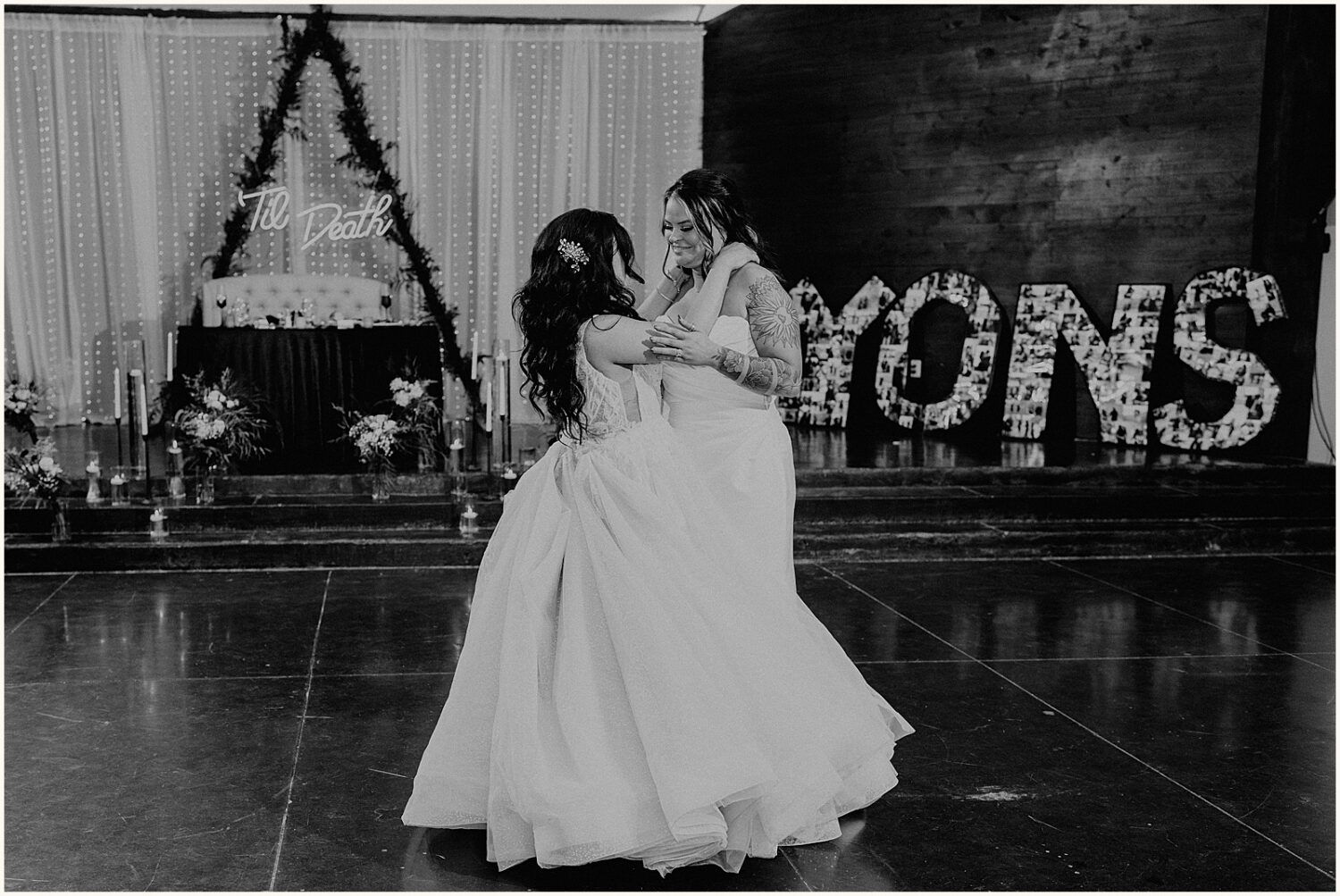 Two brides share their first dance during a wedding at Superstition Manor.