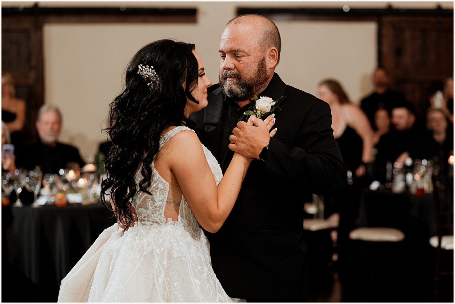 A bride dances with her father.