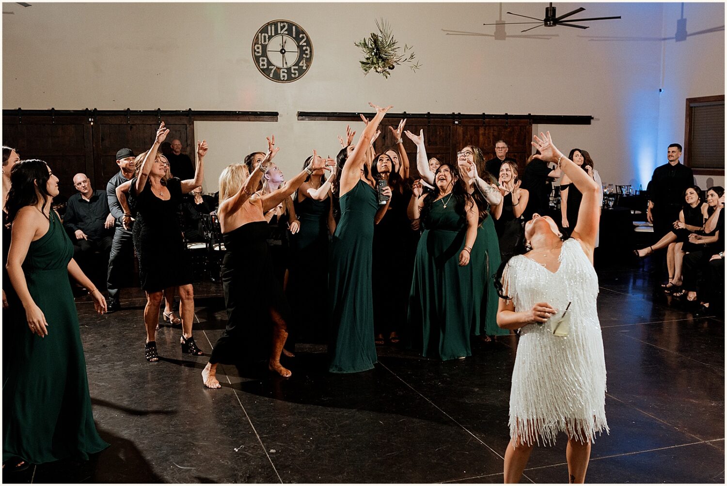 A bride tosses her bouquet.